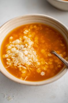 a white bowl filled with soup on top of a table