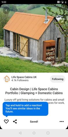 a small house with an orange roof and some words on the screen that read cabin design life space cabins