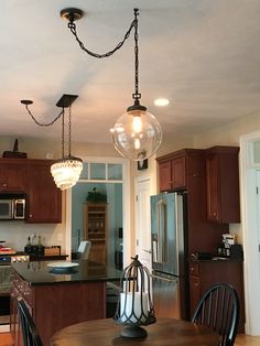 a kitchen with wooden cabinets and an island