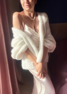 "White Mohair Cardigan - Handcrafted  Indulge in the exquisite warmth and sophistication of our Elegant Hand Knit  Mohair Cardigan. Crafted with the utmost care and attention to detail, this cardigan is the epitome of cozy luxury.  💎Stay cozy and stylish in this beautiful hand-knit white mohair cardigan. Made with love and care, this luxurious piece is perfect for layering throughout the seasons. The soft mohair yarn adds a touch of elegance, while the classic white color makes it versatile to Jacket Fluffy, Wedding Cardigan, Mohair Fabric, Fluffy Cardigan, Wool Gifts, Luxury Gifts For Her, Wedding Jacket, Mohair Cardigan, Mohair Wool