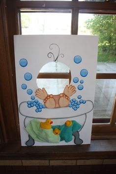 a paper cutout of a baby in the bathtub