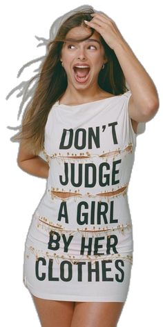 a woman wearing a white shirt with words on it saying don't judge a girl by her clothes