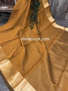 Solid ochre color sheer saree with Banarsi gold border . Mix and match with different blouses and accessories!! Soft cotton silk plain saree with a zari border palla. -Fall attached -Blouse fabric included Elegant Yellow Slub Silk Blouse Piece, Elegant Gold Cotton Silk Blouse Piece, Elegant Yellow Cotton Silk Blouse Piece, Gold Traditional Wear In Slub Silk, Gold Cotton Silk Blouse Piece For Wedding, Gold Cotton Silk Blouse For Wedding, Gold Semi-stitched Saree For Festivals, Yellow Sheer Dupatta In Slub Silk, Gold Anarkali Blouse Piece In Slub Silk