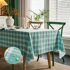 a table with a blue and white checkered table cloth on it next to a green chair