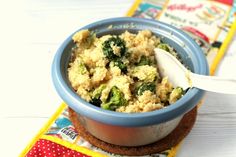 a blue bowl filled with food on top of a table