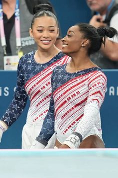 two female tennis players standing next to each other