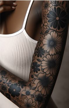 a woman's arm with flowers on it