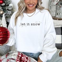 Let It Snow winter/Christmas graphic on your choice of sweatshirt (Adult).   Available in sizes for: Adults - Sweatshirts - S-XXL About our Sweatshirts, T-Shirts and Onesies Brands we use include Gildan (18000 Heavy Blend and SoftStyle), Anvil (kids) and Rabbit Skins (baby, toddler).  Brand is not guaranteed, please ask/specify if you prefer one over another. Sweatshirts are 50/50 cotton/polyester Classic, unisex fit 1x1 rib with spandex Shipping || All orders over $35 ship for free! We will com Winter Wonderland Sweater, Camp Fashion, Ugly Sweater Diy, Xmas Jumpers, Camp Style, Holiday Apparel, Sewing Workshop, Christmas Graphic, Religious Christmas