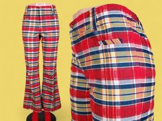 "Talk about plaid! This pair is just screaming for attention with a fantastic palette of red, navy blue, yellow, & everything in between. And that iconic 60s/70s mod fit with a mid to low rise & flared bells is just everything. The belt loops are big enough for your widest belt & there's a zip fly with a snap closure. In front there are 2 welted stash pockets & the rear view is extra cute with a bare back & contouring darts. These are lightweight, not lined, & have the original professional  hem Retro Fitted Plaid Bottoms, Retro Plaid Wide-leg Pants, Fitted Vintage Plaid Bottoms, January Fits, Vintage Plaid Pants, 60s Pants, Funky Clothing, Quilted Pants, Rat King