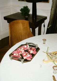 a table with flowers and candles on it