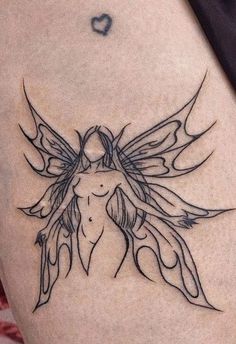 a woman's thigh with a tattoo design on it