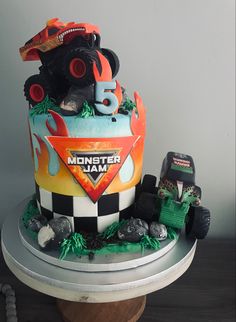 a monster jam themed cake on top of a table