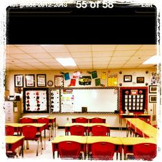 an empty classroom with desks and chairs