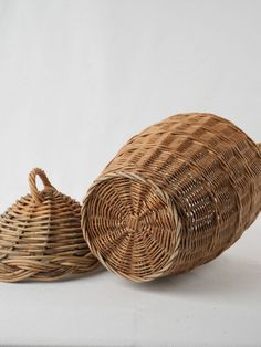 two wicker baskets sitting next to each other