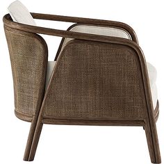 a chair that is made out of wicker and has white cushions on the back