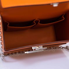 Introducing the Hermes Cinhetic Bag. The Cinhetic Bag was introduced in the brand’s Spring/Summer 2017 Collection, it was presented in the runway as a boxy shape with top handle. The bag features an asymmetrical H closure which comes in palladium plated or triple finishing plated. The boxy top handle includes a chain strap. Perfect cross body day into night. Love the roominess of this perfect everyday statement bag. Condition: Store FreshColor: AbricotMaterial: Mysore GoatHardware: PalladiumMeas Luxury Business Box Bag With Dust Bag, Designer Box Bag With Silver-tone Hardware For Travel, High-end Epsom Leather Shoulder Bag For Everyday Luxury, Luxury Epsom Leather Rectangular Shoulder Bag, Luxury Square Shoulder Bag With Silver-tone Hardware, Luxury Clutch Box Bag, High-end Formal Box Bag With Dust Bag, Luxury Box Bag With Silver-tone Hardware, Luxury Shoulder Bag With Palladium Hardware