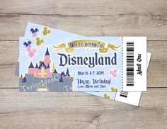 the ticket for disneyland is shown on a wooden table