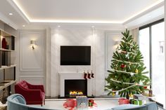 a living room with a christmas tree in the corner