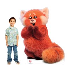 a young boy standing next to a red stuffed animal that looks like a little fox