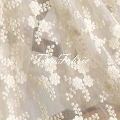 Embroidery Lace Fabric,Mesh Embroidered Lace, Tulle Lace Fabric With Flowers,Bridal Lace Fashion Wedding Dress - by the half yard Detailed information about this fabric: ♥Width:49 inches(125 cm) ♥ Fabric is sold by 1/2 yard QTY buy 1 piece, is 1/2 yard It will be one continuous piece if multiple quantities was ordered. ♥ Materials: mesh Others: ♡ Wholesale can be accepted ♡ Custom order can be accepted ♡ International order can be accepted ♡ Feel free to contact me if there is any other special Cream Tulle Fabric With Floral Embroidery, Spring Lace Tulle Fabric With Floral Embroidery, White Tulle Fabric With 3d Lace Embroidery, White Tulle Fabric With Floral Applique, White Delicate Lace Tulle Fabric, White Lace Tulle Fabric With Floral Applique, Star Embroidery, Tulle Lace, Lace Fashion