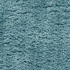 a close up view of the texture of a blue carpet