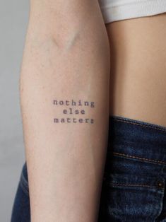 a woman's arm with the words nothing else matters written on it