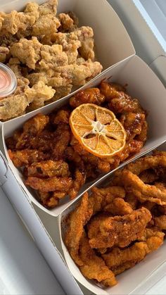 three boxes filled with different types of food on top of a white countertop next to each other