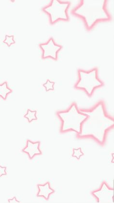 white and pink stars are flying in the air