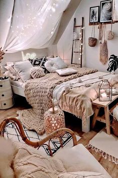 an attic bedroom with white walls and wooden floors, decorated in neutral tones such as beiges and whites