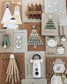 many different items are displayed together on the table, including christmas cards and magnets