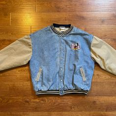 This Vintage Disneyland Jacket Is A Must-Have For Any True Fan Of Mickey Mouse And Disneyland. The Blue Denim Material Is Quilted For Extra Warmth And Features A Varsity Snap Closure. The Jacket Is Size Xxl And Has A 90s Year Design. It Is Perfect For Adults Who Want To Show Off Their Love For Disney And Add A Unique Piece To Their Collection. The Jacket Is Made In China And Is An Authentic Disney Franchise Product. Jacket Features A Side Slant Pockets, Inside Breast Pocket, Cotton Body Lining, Spring Denim Outerwear For College, Casual Long Sleeve Denim Jacket For College, Retro Denim Patchwork Outerwear, Long-sleeved Cotton Denim Jacket For College, Long Sleeve Cotton Denim Jacket For College, Cotton Long Sleeve Denim Jacket For College, Vintage Denim Patchwork Outerwear, Disney Jacket, Coats Vintage