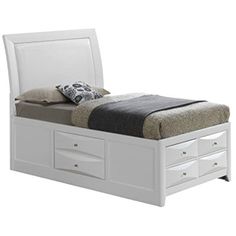 a white bed with drawers underneath it and a black blanket on top of the bed