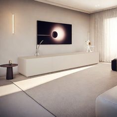 a living room filled with furniture and a flat screen tv mounted to the side of a wall