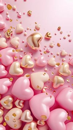 pink and gold hearts floating in the air