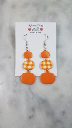 Handmade triple pumpkin-shaped dangle earrings in a solid orange and orange plaid pattern. Made from polymer clay. Mounted on hypoallergenic hooks. Smoke-free, pet-free home. Orange Dangle Earrings Polymer Clay, Orange Dangle Polymer Clay Earrings, Orange Dangle Earrings In Polymer Clay, Orange Polymer Clay Dangle Earrings, Solid Orange, Gold Clips, Orange Plaid, Gold Earrings Dangle, New Hobbies