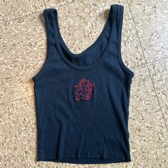 Basic, Ribbed Tank Top With A Scoop Neck And Matching Trimmings And Devil Embroidered On Chest Fabrics: 100% Cotton Measurement: 17" (43 Cm) Length, 12" (30 Cm) Bust Made In: Europe Nwot Casual Embroidered Fitted Tank Top, Black Embroidered Stretch Tops, Tops Brandy Melville, Wrap Tank Top, Brandy Melville Tank Top, Black Crop Top Tank, Strappy Tank Tops, Green Tank Top, Ribbed Tank Top