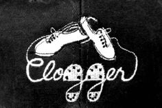 a close up of a hat with shoes on the front and word clogger written in white