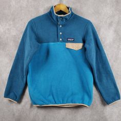 Patagonia Lightweight Synchilla Snap-T Fleece Pullover Sweater Condition: New With Tags Size: Women's Size Large Color: Anacapa Blue Season Released: Fall 2022 Regular Fit Hip Length Features: Stand-Up Collar And Snap Placket Yoke-Seam Detail With Nylon Chest-Pocket Flap And Snap Closure Spandex Binding At Sleeve Openings And Hem Ships Within One Business Day With Usps Patagonia Winter Tops With Pockets, Patagonia Casual Fleece Tops, Patagonia Blue Tops For Outdoor Activities, Casual Patagonia Fleece Top, Casual Blue Fleece Jacket For Outdoor Activities, Blue Long Sleeve Hiking Tops, Blue Long Sleeve Top For Hiking, Casual Midweight Blue Fleece Jacket, Midweight Blue Fleece Jacket For Winter