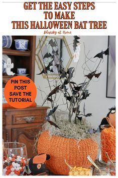 an easy halloween decoration with fake bats and pumpkins