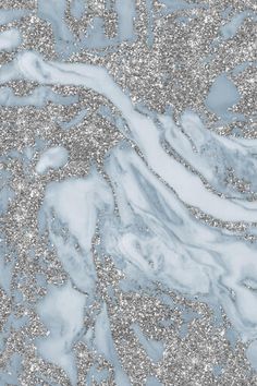 an abstract marble background with silver glitters and waves in the center, as if it were made from paper or fabric