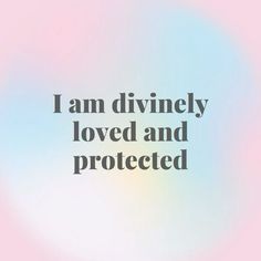 the words i am divinely loved and protected against a blurry blue sky background