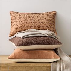 several pillows stacked on top of each other