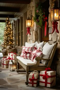 a porch decorated for christmas with presents and lights