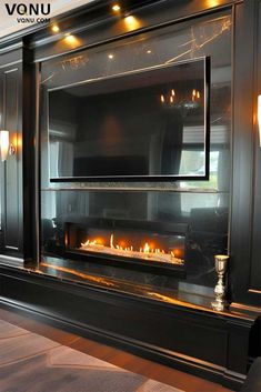 an elegant fireplace with candles lit in it