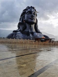 a large statue is sitting on the ground