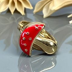 Red Enamel Mushroom Ring- Sterling Silver, Yellow or Rose Gold Filled Wire & Gold Tone Zinc Alloy Bead -Size 4 5 6 7 8 9 10 11 12 13 14 *This mushroom bead and wire wrapped ring is handmade with an approximately 17mm x 15mm gold tone zinc alloy bead and your choice of wire type for the band. *This can be a two toned ring as the bead remains gold in color regardless of the wire band color/metal type you select for the band. *This ring (as well as all the others in my shop) is custom made to any s Red Mushroom Design Jewelry Gift, Adjustable Gold Whimsical Rings, Whimsical Adjustable Gold Rings, Adjustable Red Enamel Rings, Mushroom Ring, Argentium Silver, Wire Wrapped Rings, Beads And Wire, Silver Rose Gold