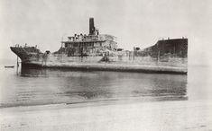 an old black and white photo of a ship in the water