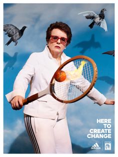 a man holding a tennis racquet with birds flying around him