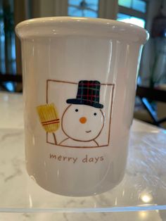 a frosty cup with a snowman on it