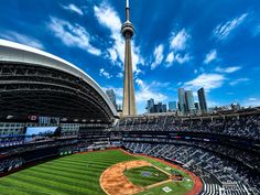 a baseball stadium with the sky in the background